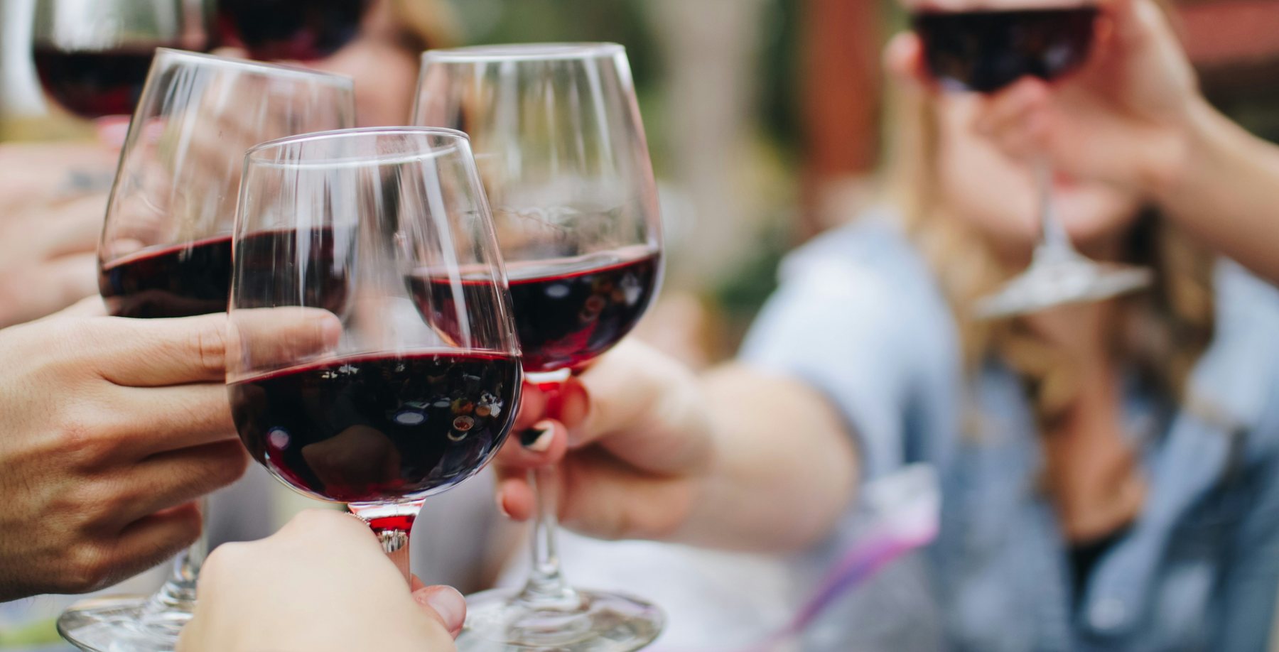 Guests raising glasses of wine at Simaredo